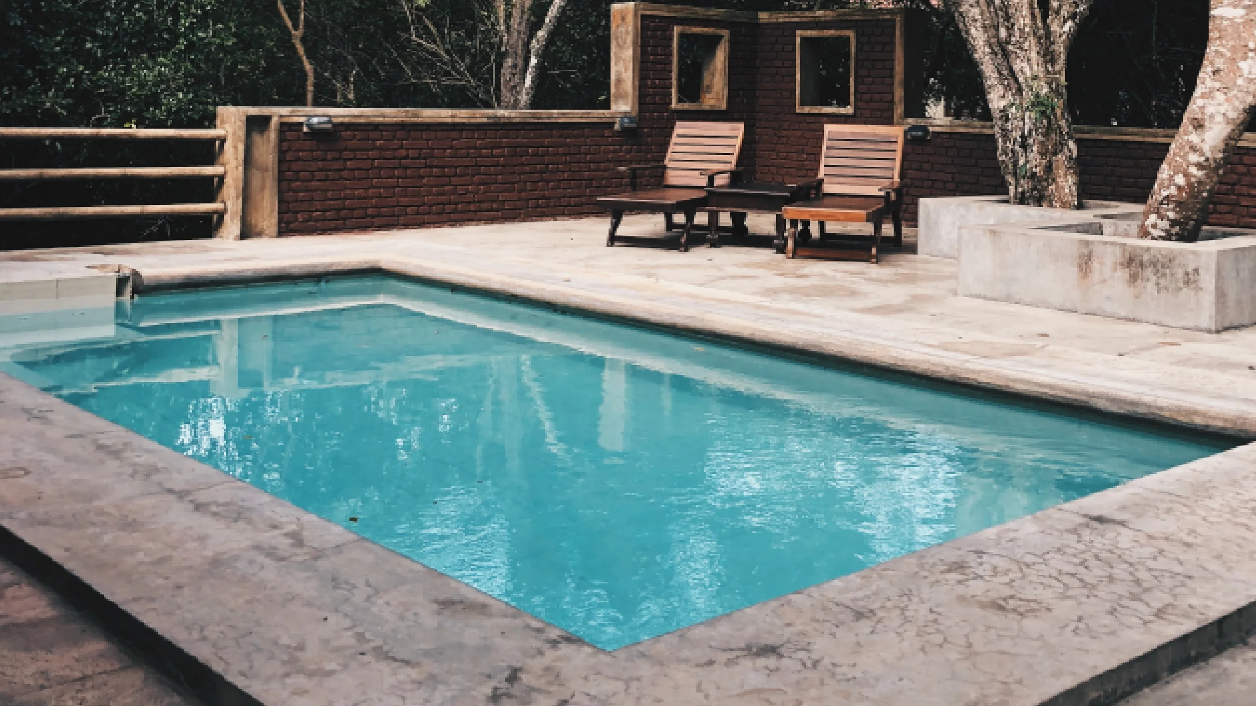 remodeling (1) rectangle pool with reclining chairs and stone surround